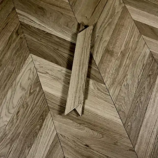 Luxury Chevron Invisible Oak Oiled Flooring showcasing brushed European oak with seamless V-shaped pattern and invisible oiled finish.