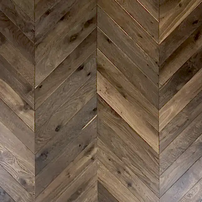 Close-up of Double Smoked Chevron Oak flooring showing authentic aged texture, rich smoked tones, and brushed & oiled finish