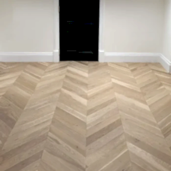 Chevron invisible oak flooring installed in a modern interior, featuring matt lacquer finish and elegant chevron pattern