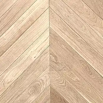 Close-up view of Chevron Prime Unfinished Oak Wood Flooring 92mm highlighting authentic oak grain and precision parquet pattern