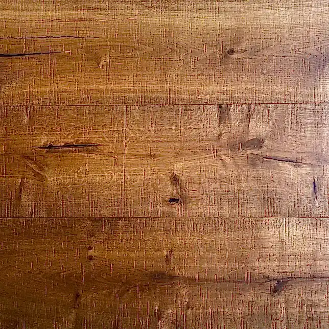 Angled sideways view of New Heritage XL smoked oak bandsawn flooring showing wide planks and brushed grain