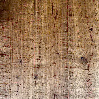 Close-up of New Heritage XL smoked oak engineered flooring with visible bandsawn texture and rich oiled surface