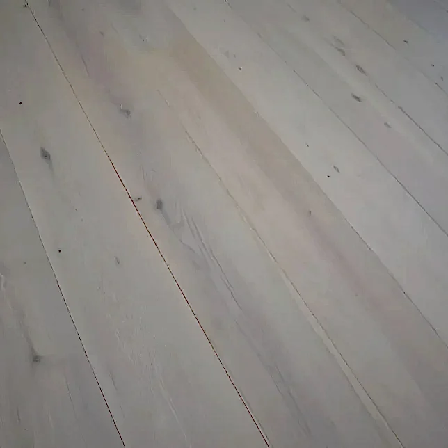Close-up of Eco Range Cotton White Oak UV Oiled engineered wood flooring showing natural oak grain and smooth finish