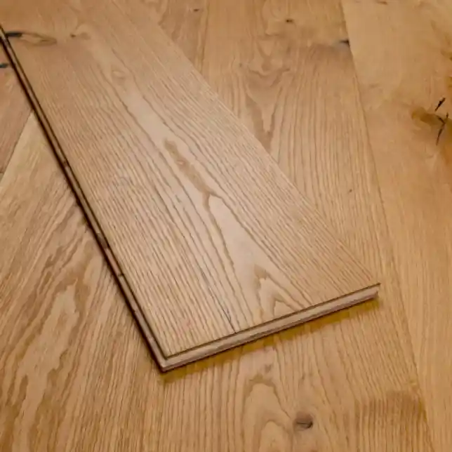 Close-up of Eco Range Natural Oak Brushed UV Oiled flooring with individual plank displayed in the center