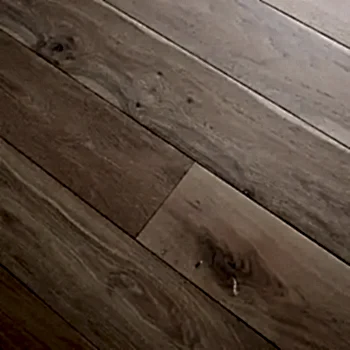 Angled image showing Eco Range Iceberg Oak flooring with light brushed texture and oil-enhanced pale oak surface tones