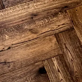 Ditorian Oak Herringbone Lacquered Flooring close-up highlighting rich grain and brushed oak texture